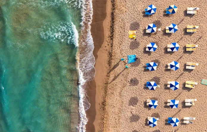 glyfadacorfubeachshutterstock2233106657-696x445.jpg